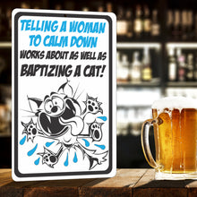 Load image into Gallery viewer, Funny Metal Cat Sign for Indoors or Outdoors -Telling a Woman to Calm Down Works About as Well as Baptizing a cat! - Size 8 x 12
